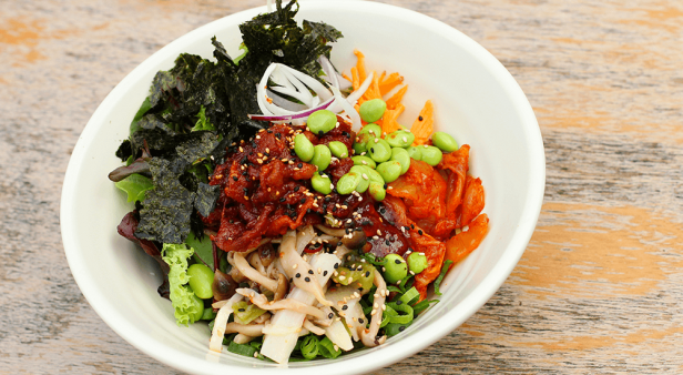 Spicy pork bibimbap with vegetables and spicy sauce