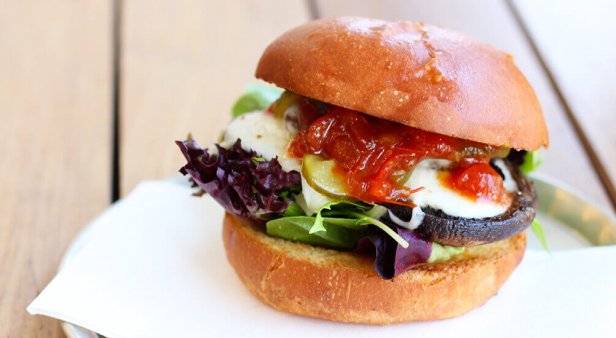 Make My Day mushroom burger with smoked mozzarella, butter pickle, relish and greens