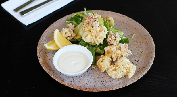 Salt and pepper calamari with zucchini, artichoke and rocket salad